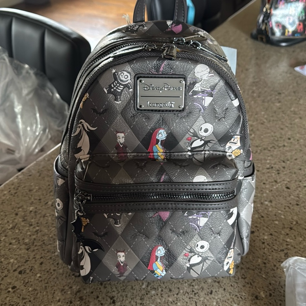 Disney Loungefly “The Nightmare Before Christmas” mini backpack, wallet, ears.